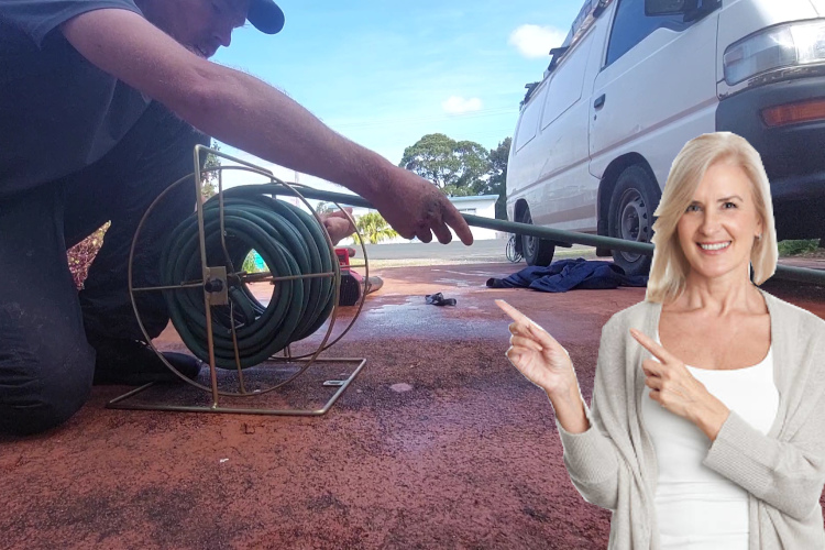 
Wrapping up the day`s work, a nowra gutter cleaner packs away the hose.